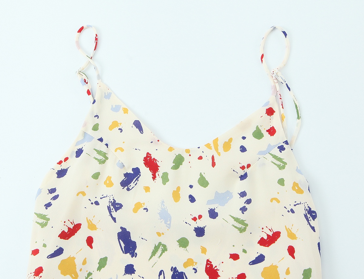 Elegante abito sottoveste midi con stampa astratta e laccetti sul retro.
