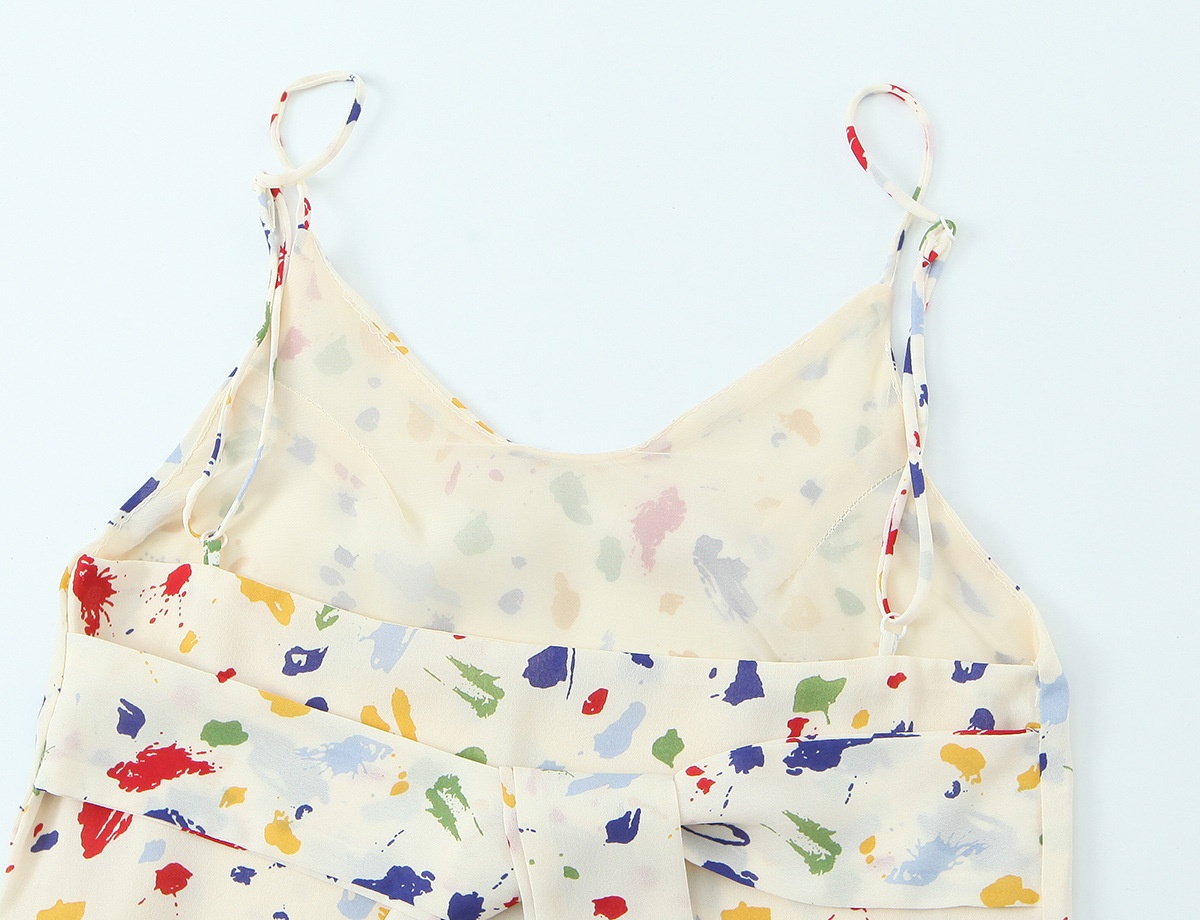 Elegante abito sottoveste midi con stampa astratta e laccetti sul retro.