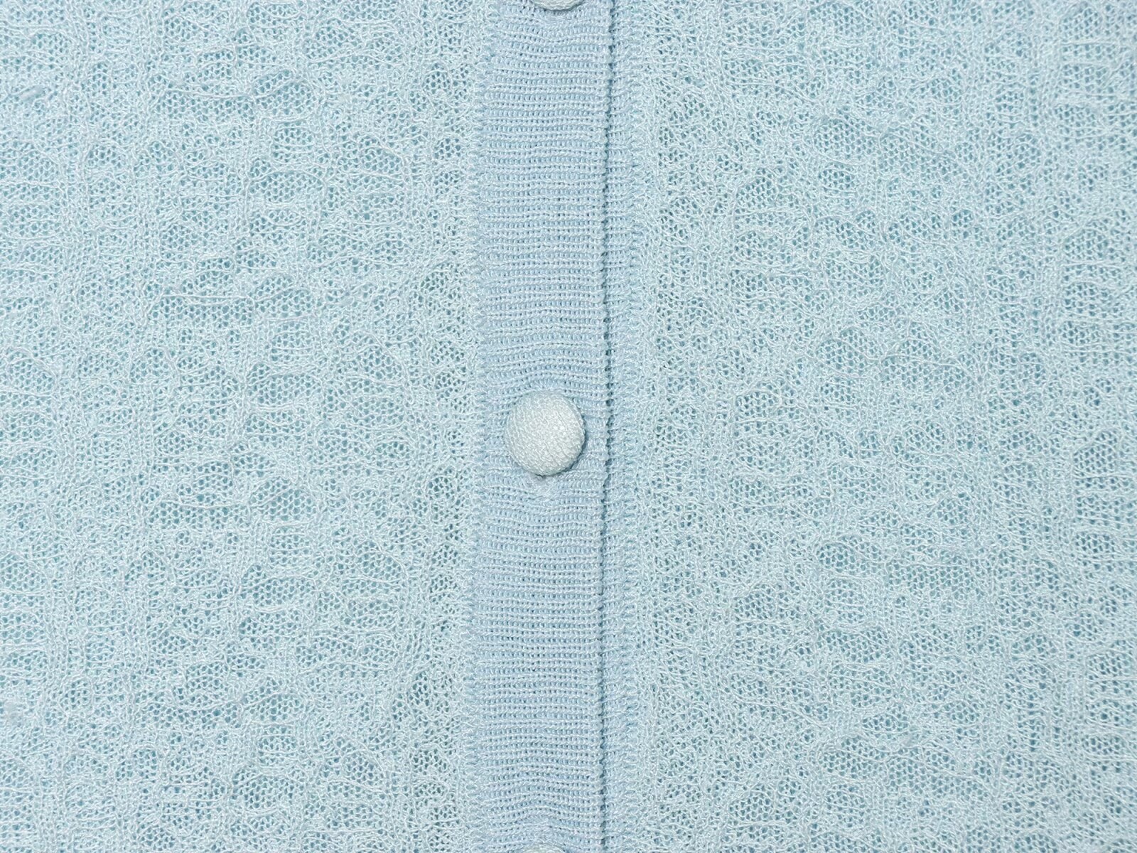Cardigan chic a maniche corte con texture e volant.