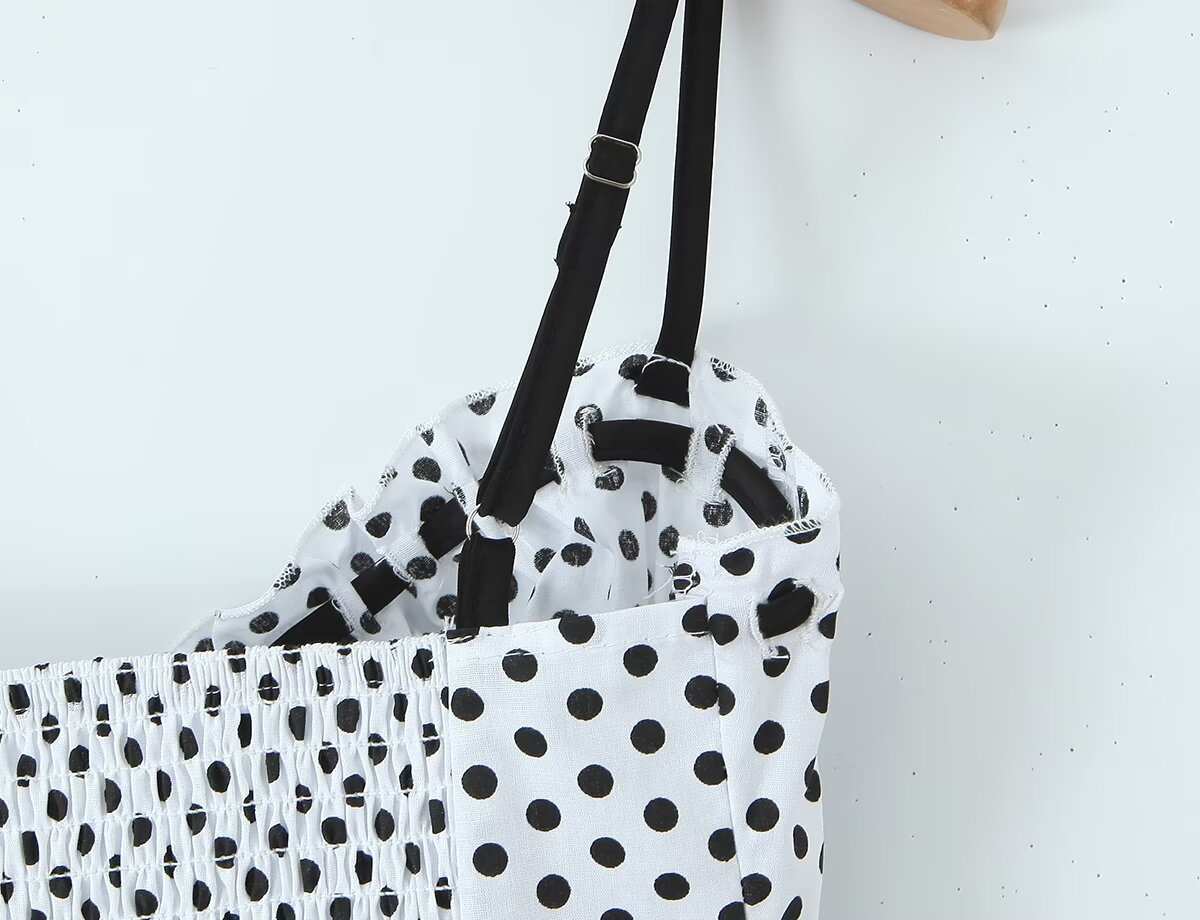 Elegante top a canotta con laccetti sul davanti a pois e quadretti.