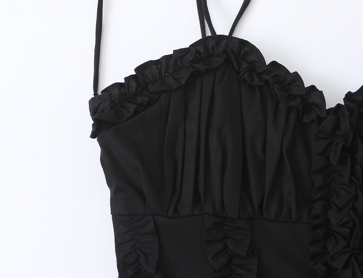 Elegante top a corsetto con volant e spalline da annodare.