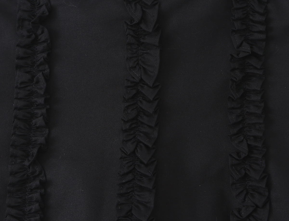 Elegante top a corsetto con volant e spalline da annodare.