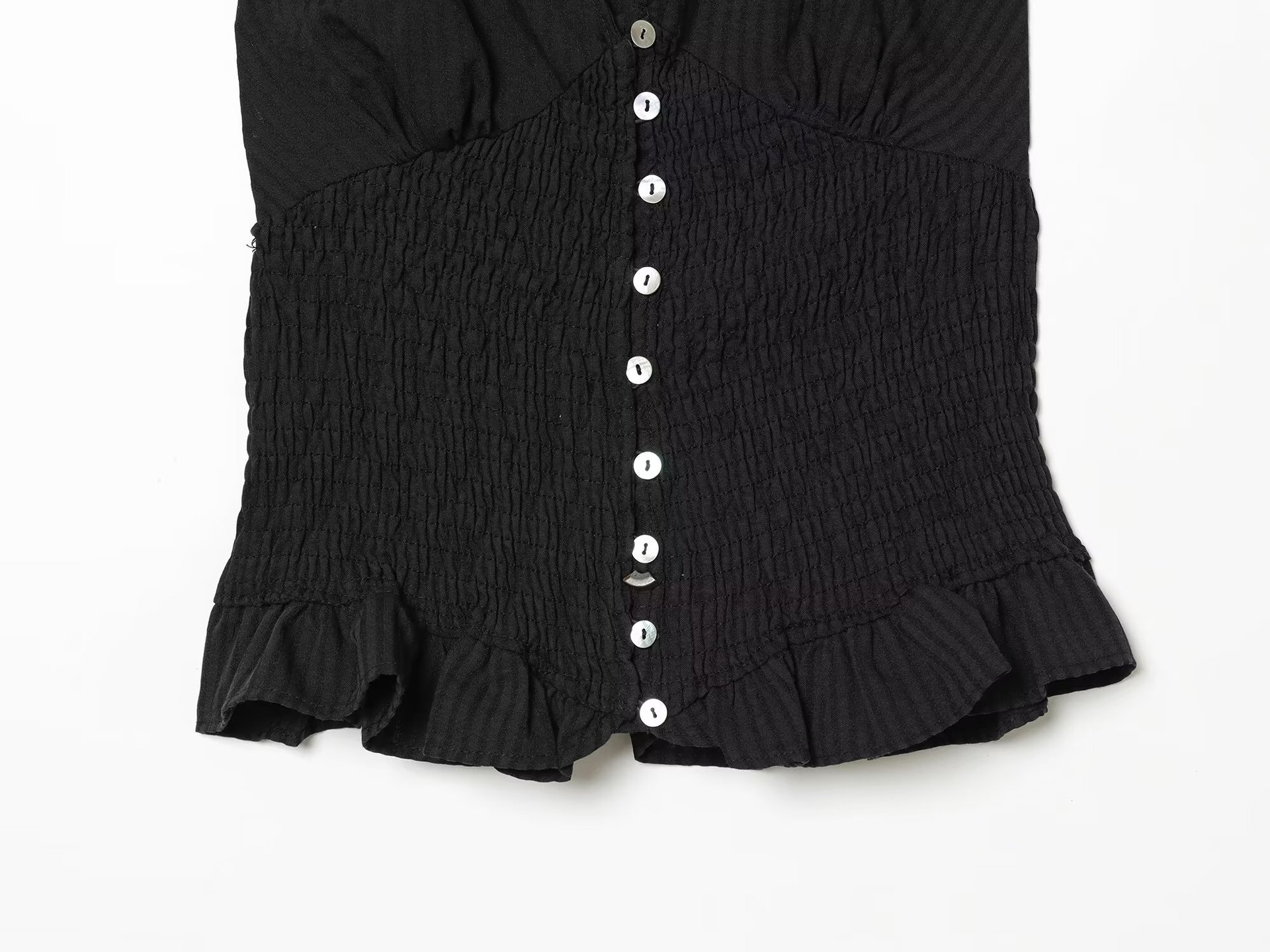 Elegante top a collo alto con volant arricciati - a quadri neri e beige