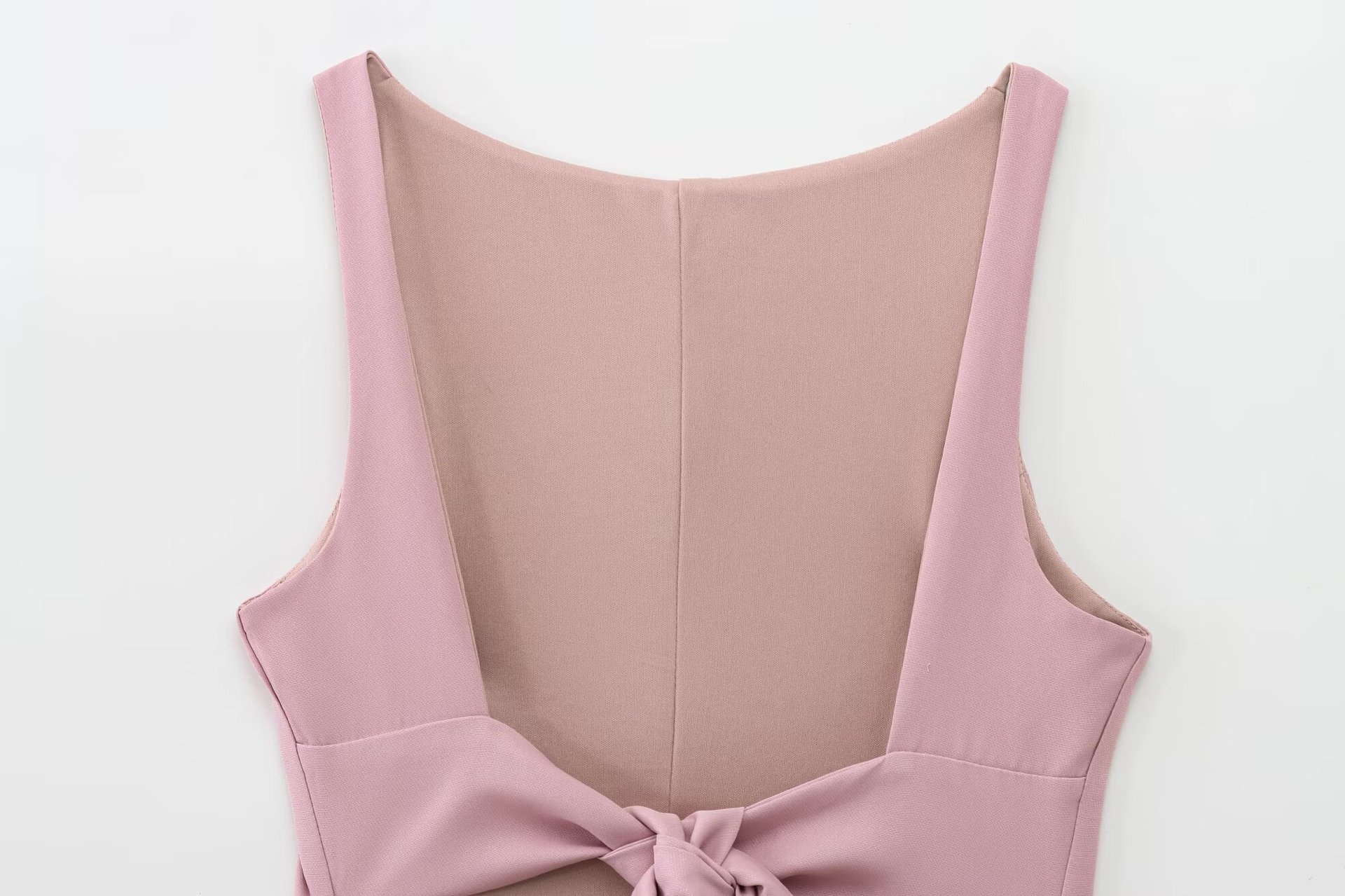 Top peplum da donna senza maniche con fiocco sulla schiena