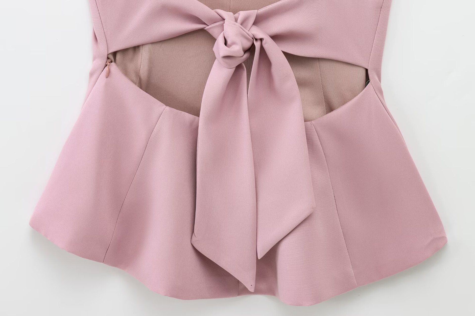 Top peplum da donna senza maniche con fiocco sulla schiena