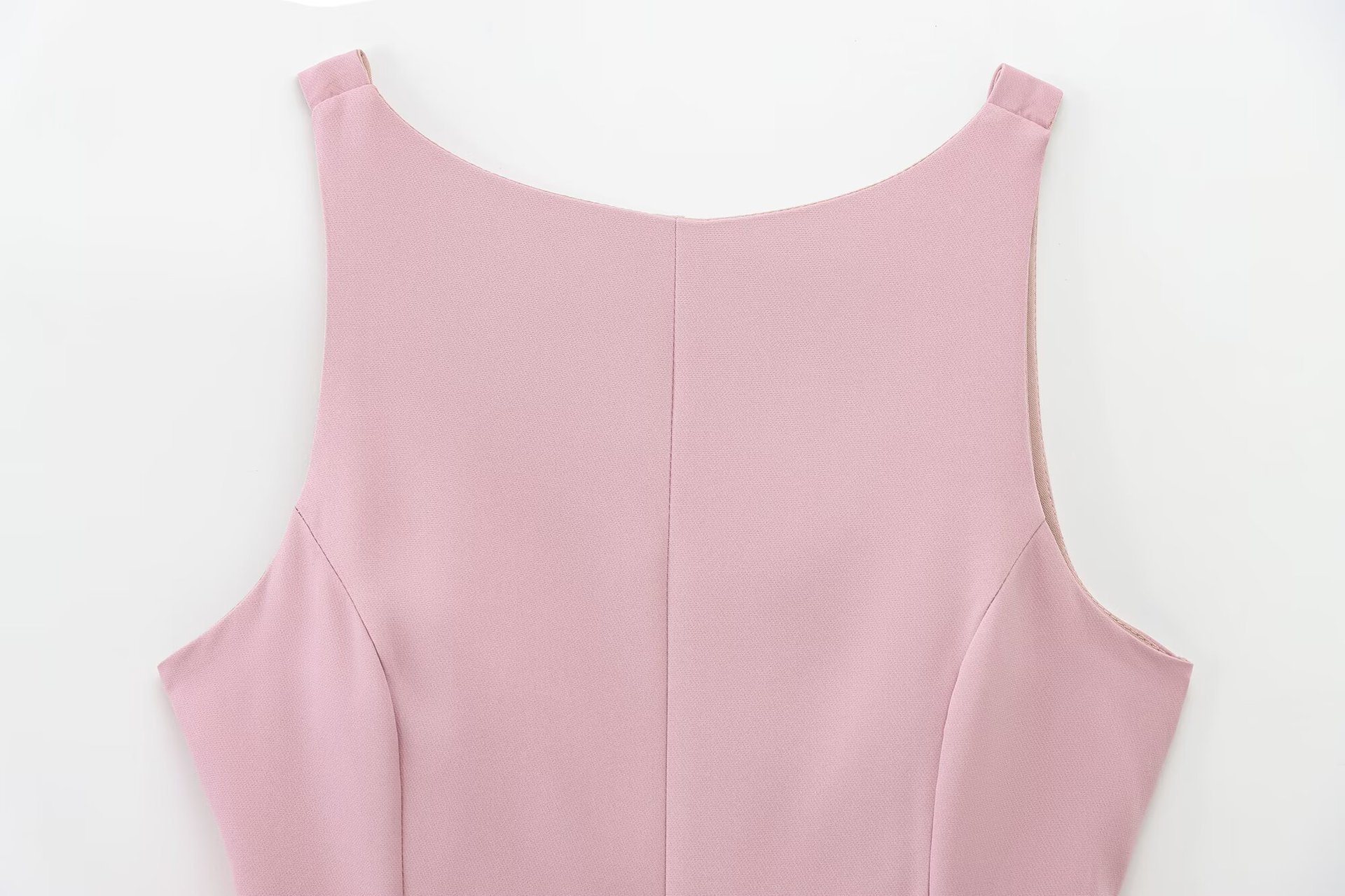 Top peplum da donna senza maniche con fiocco sulla schiena
