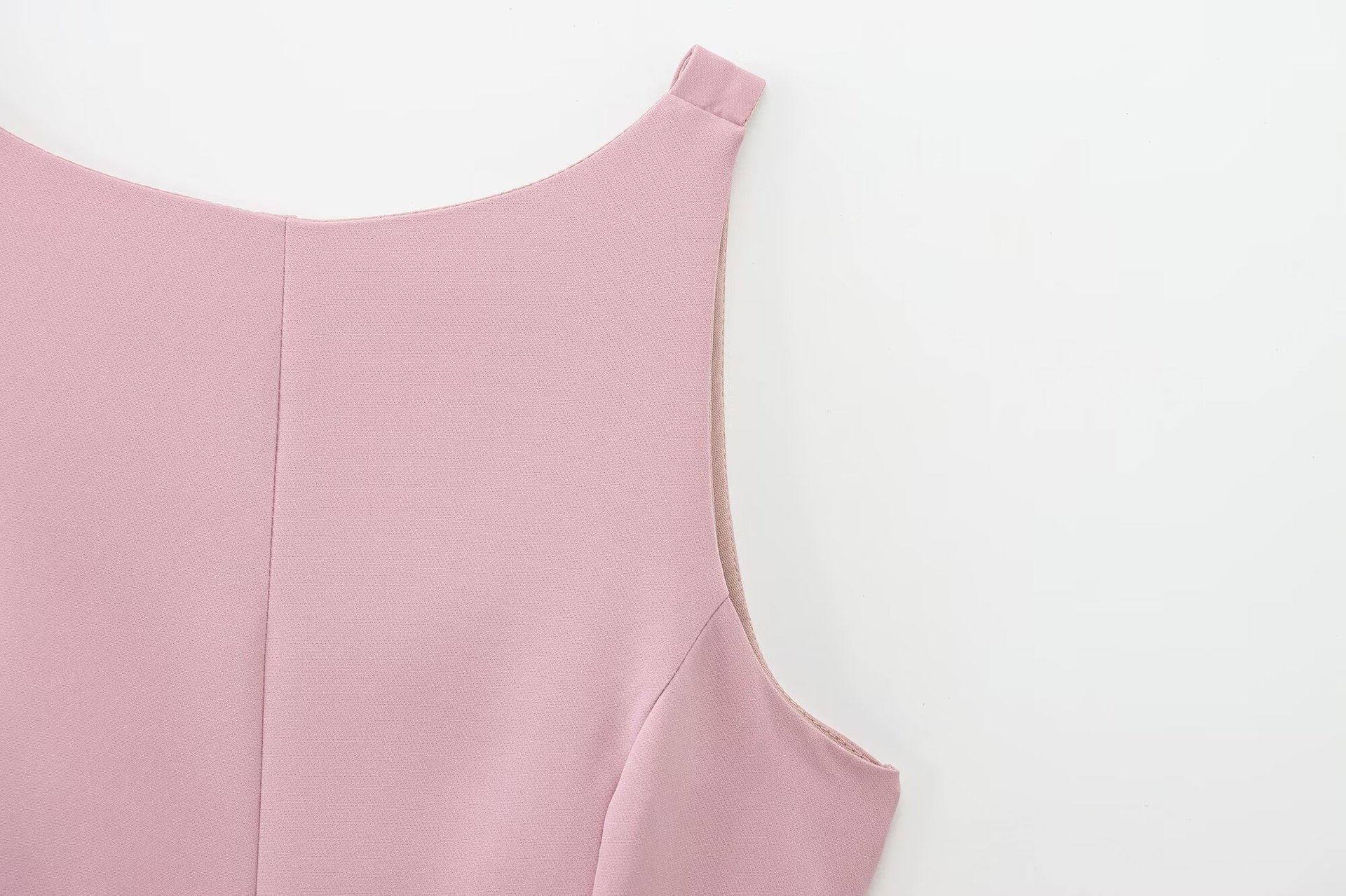 Top peplum da donna senza maniche con fiocco sulla schiena