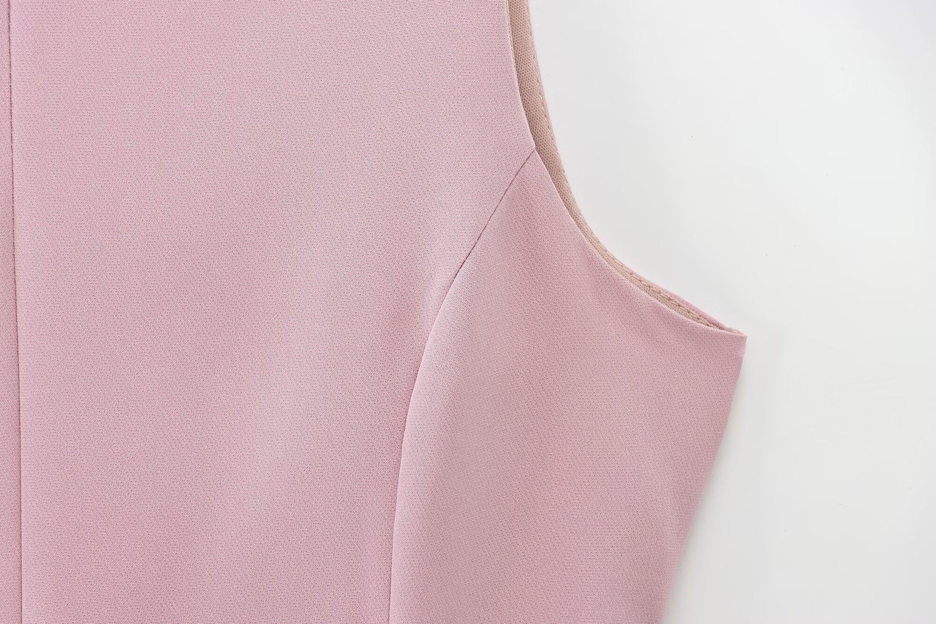 Top peplum da donna senza maniche con fiocco sulla schiena