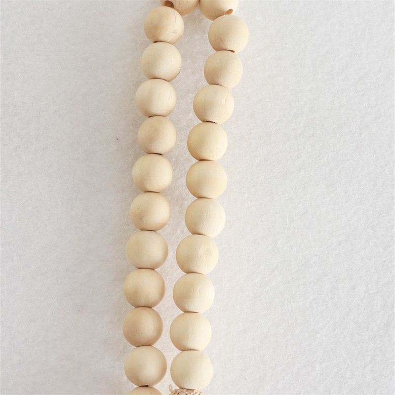 Elegante top monospalla a coste beige con spallina impreziosita da perline.