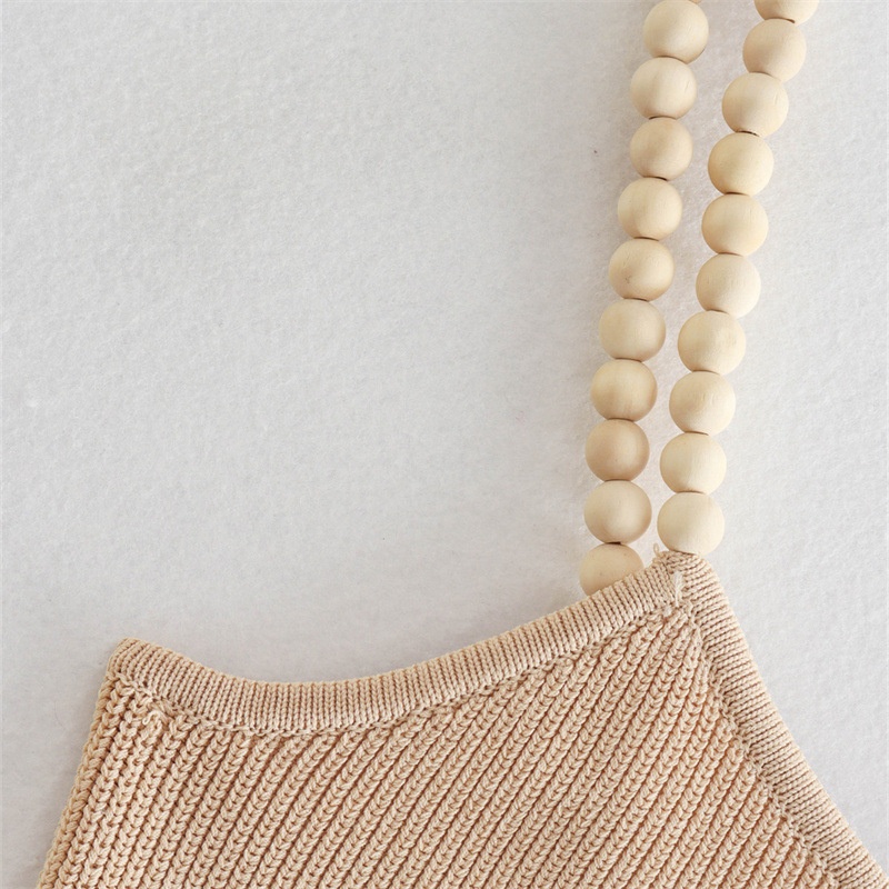 Elegante top monospalla a coste beige con spallina impreziosita da perline.