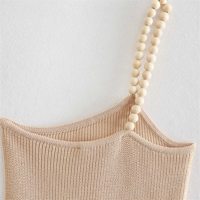 Elegante top monospalla a coste beige con spallina impreziosita da perline.