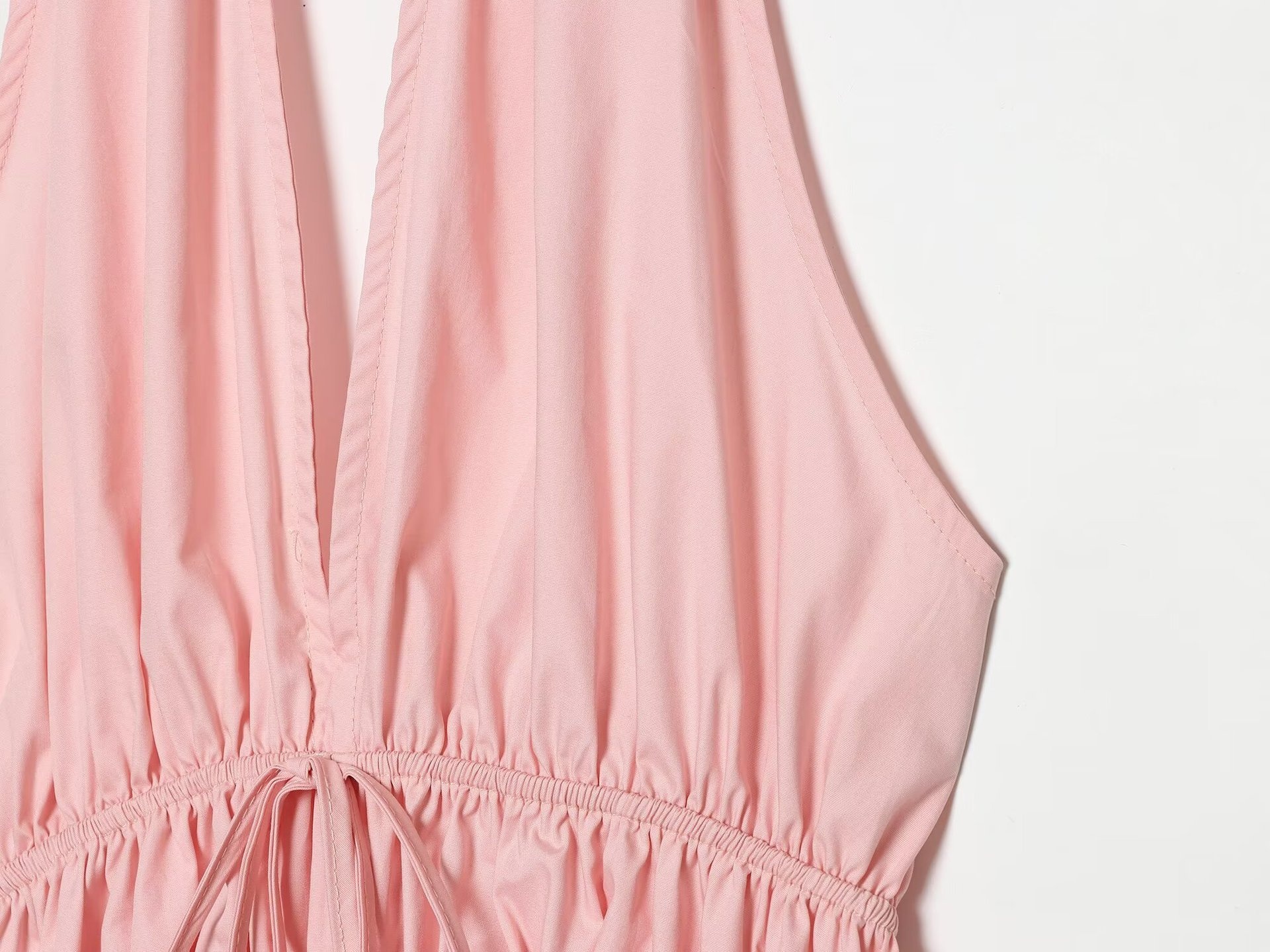 Elegante top peplum con scollo all'americana e coulisse in vita