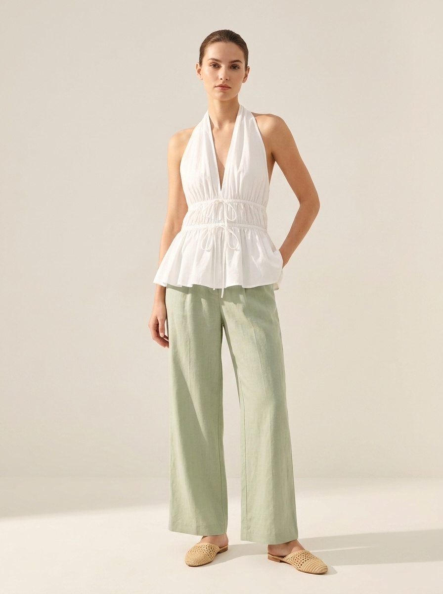 Elegante top peplum con scollo all'americana e coulisse in vita