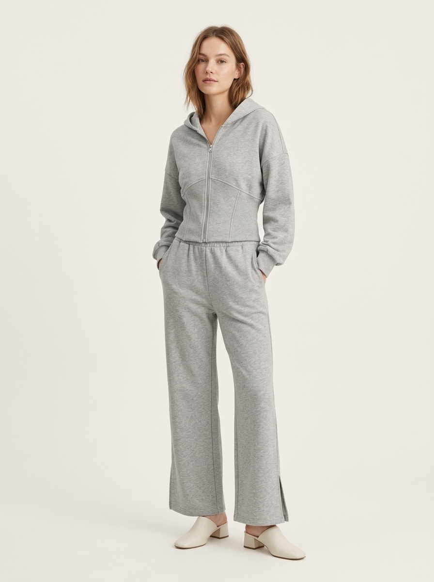 Completo composto da felpa con cappuccio a corsetto e pantaloni a gamba larga color grigio melange
