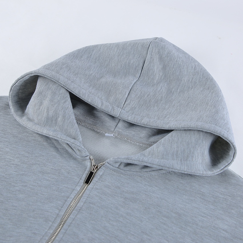 Completo composto da felpa con cappuccio a corsetto e pantaloni a gamba larga color grigio melange