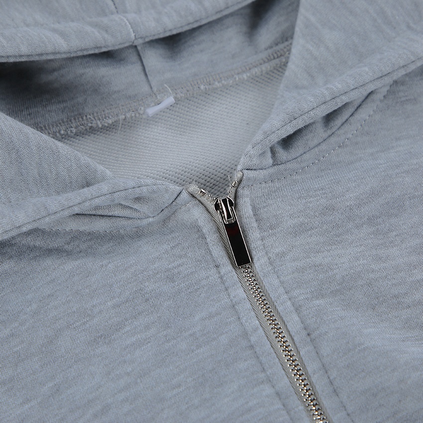 Completo composto da felpa con cappuccio a corsetto e pantaloni a gamba larga color grigio melange