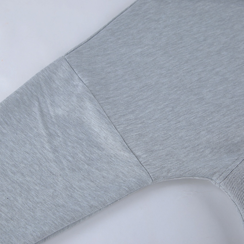 Completo composto da felpa con cappuccio a corsetto e pantaloni a gamba larga color grigio melange