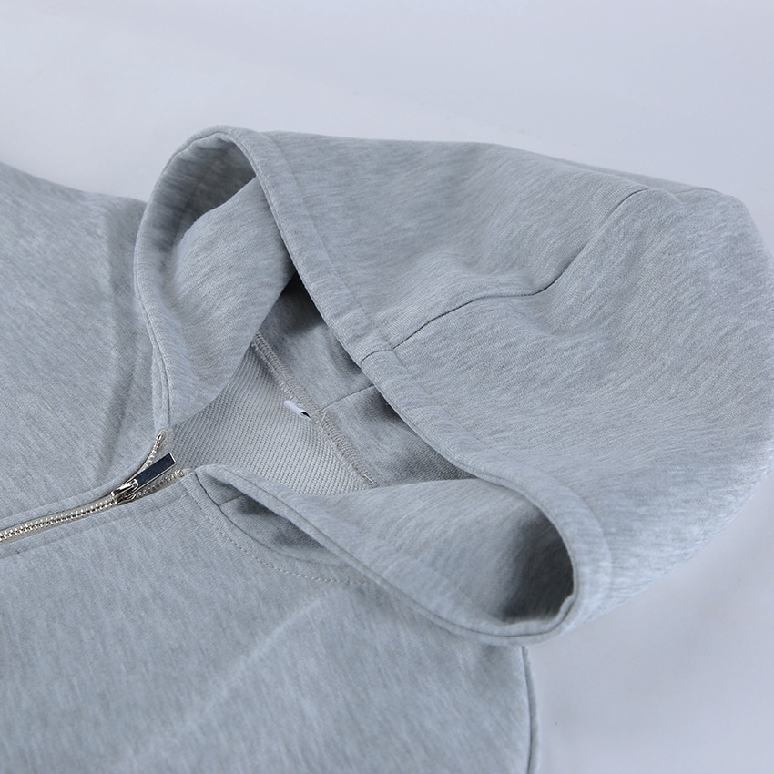 Completo composto da felpa con cappuccio a corsetto e pantaloni a gamba larga color grigio melange