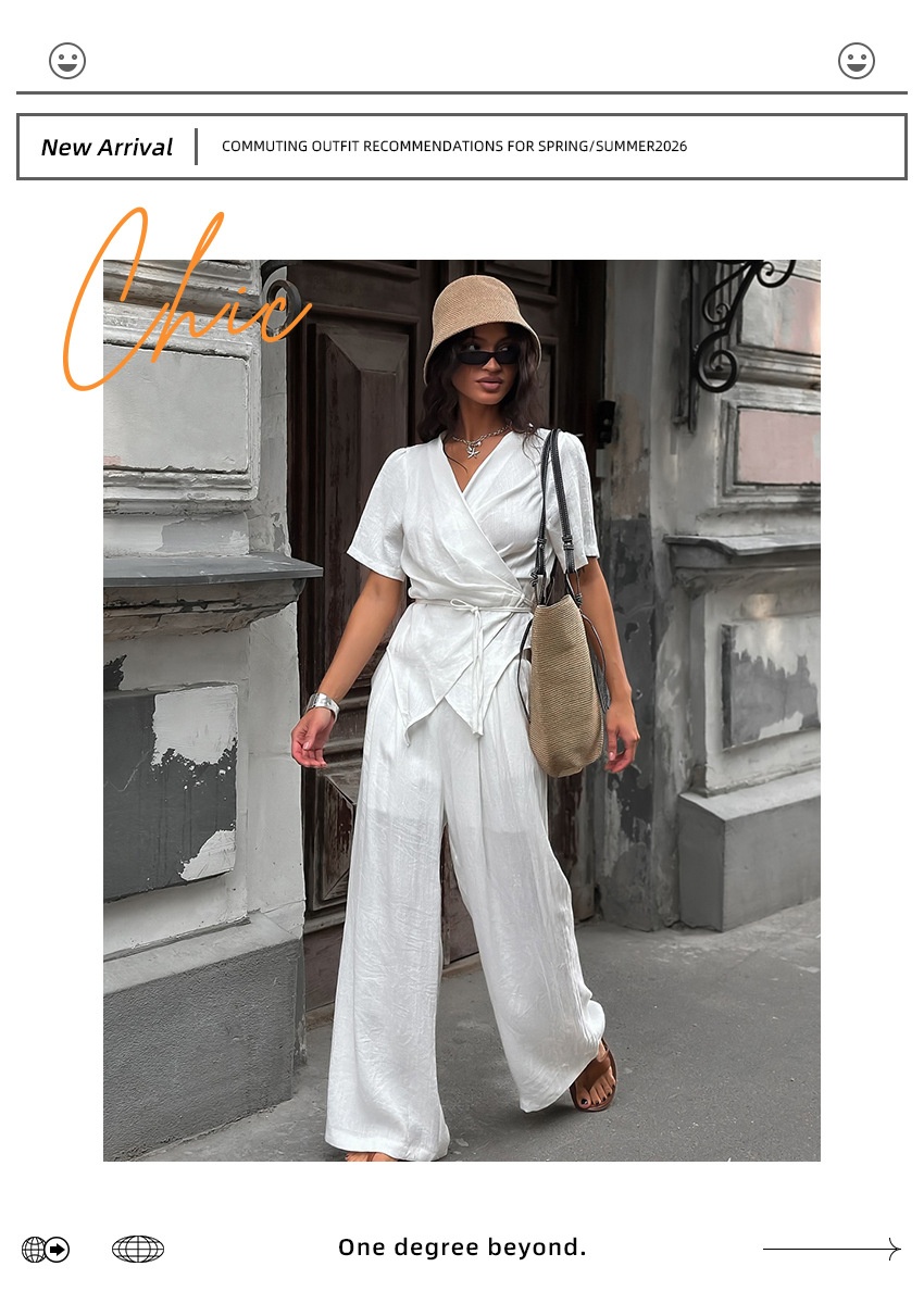 Completo da donna composto da top a portafoglio bianco e pantaloni a gamba larga.
