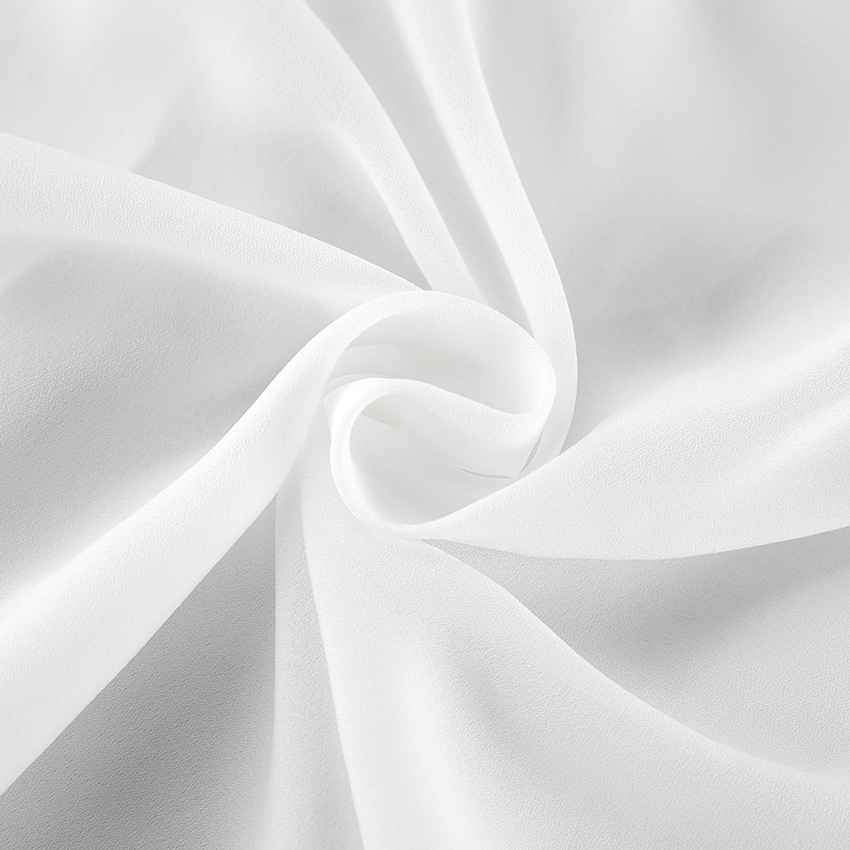 Chemisier en mousseline à volants et col noué