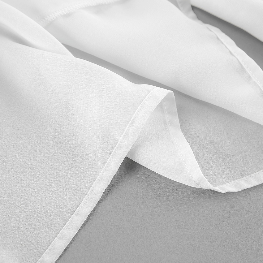 Chemisier en mousseline à volants et col noué