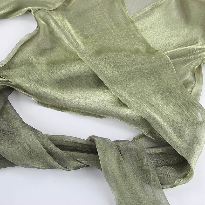 Blusa corta avvolgente verde scintillante e trasparente con nodo sul davanti