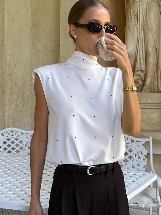 Chemisier sans manches à pois et col montant avec lien dans le dos