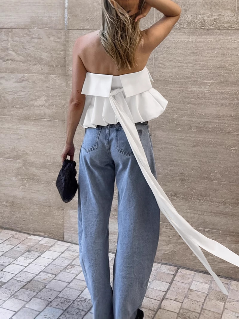 Top blanc bustier à ourlet bouffant et long nœud dans le dos