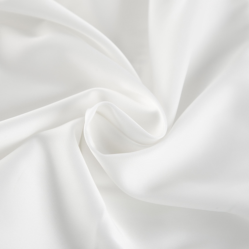 Top blanc bustier à ourlet bouffant et long nœud dans le dos