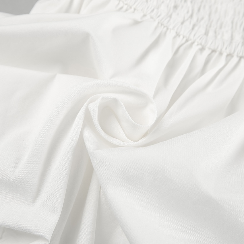 Haut péplum blanc chic sans bretelles