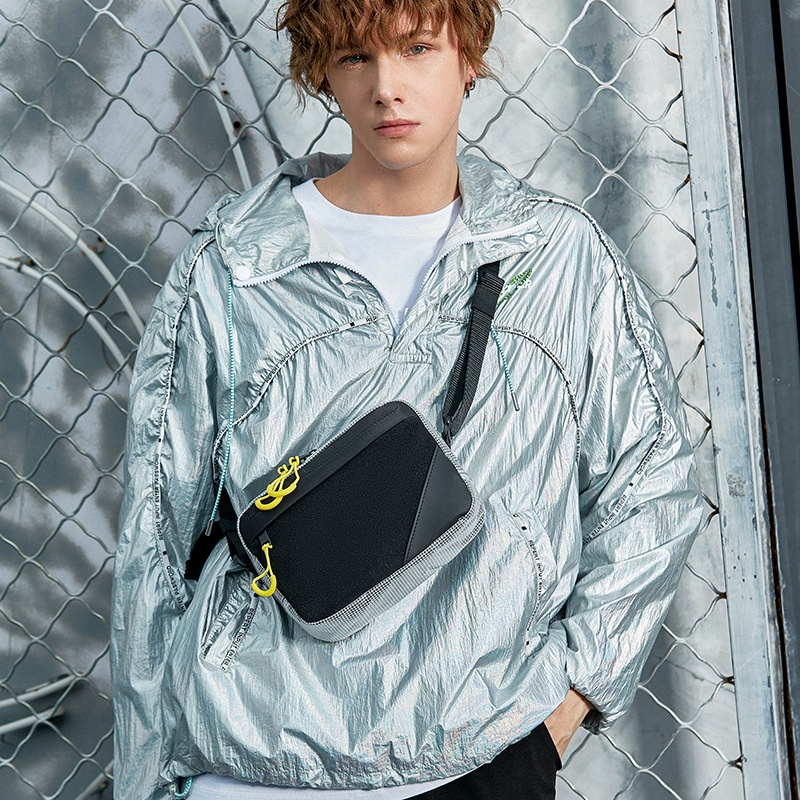 Sleek Black Crossbody Bag with Bright Yellow Zippers