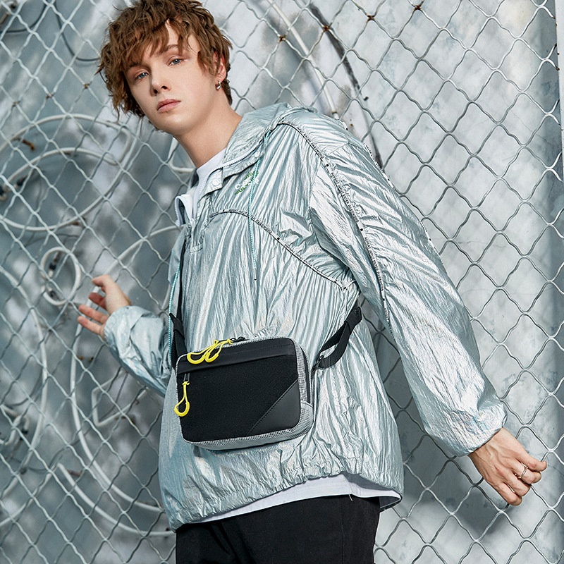 Sleek Black Crossbody Bag with Bright Yellow Zippers