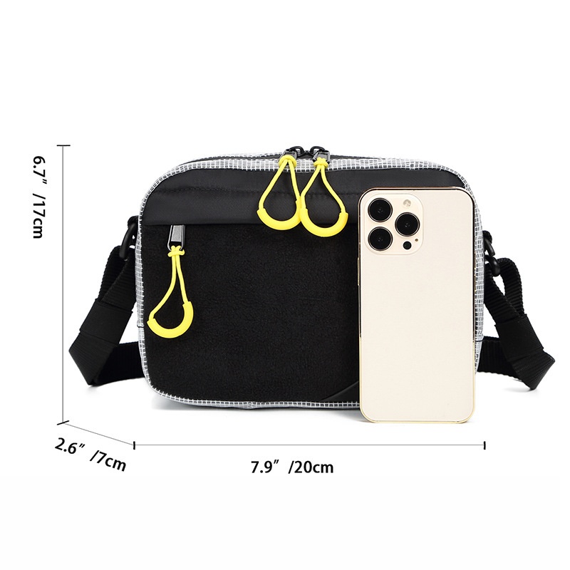 Sleek Black Crossbody Bag with Bright Yellow Zippers