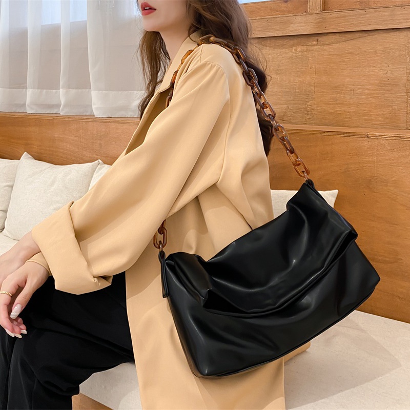 Chic Black Shoulder Bag with Tortoiseshell Chain