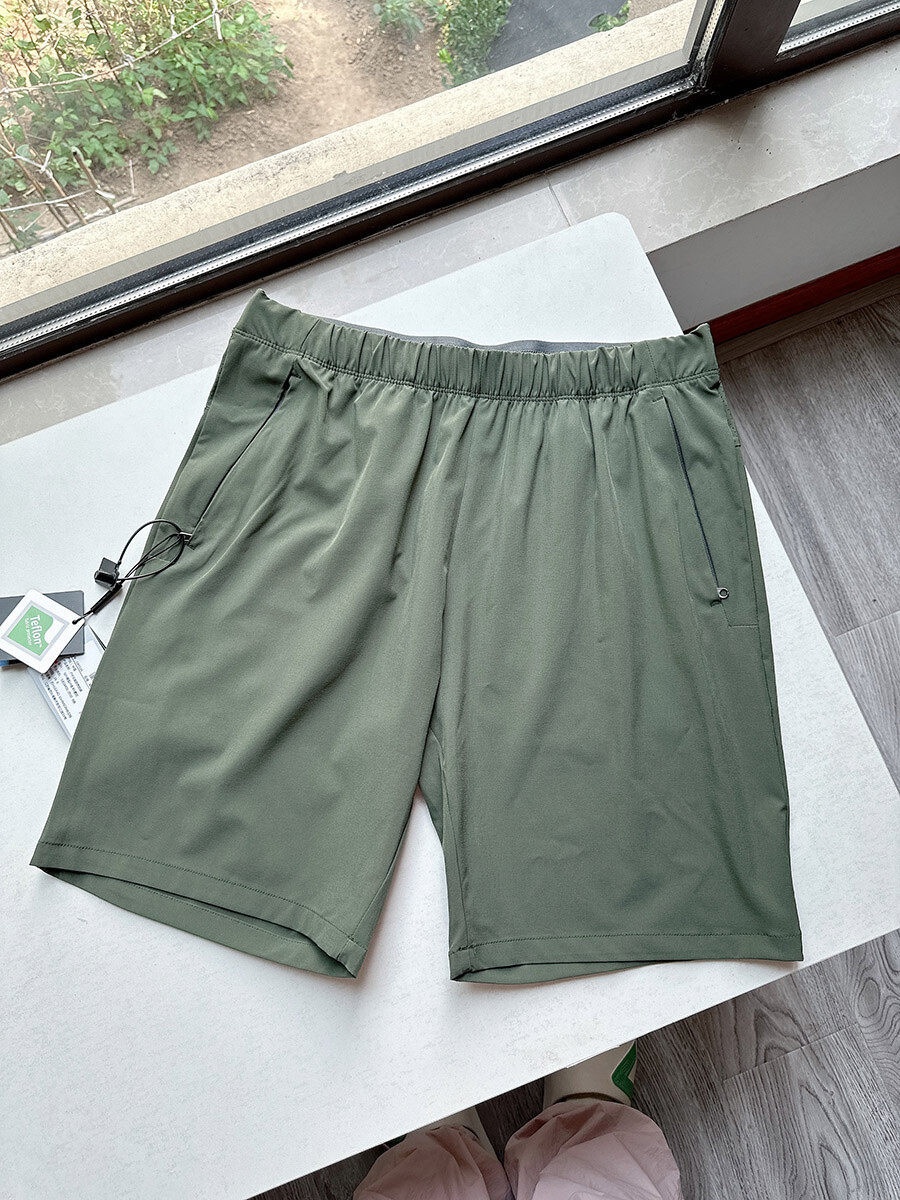 Pantaloncini sportivi da uomo in tessuto Teflon ad asciugatura rapida con tasche con cerniera.