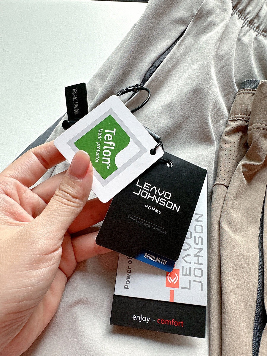 Pantaloncini sportivi da uomo in tessuto Teflon ad asciugatura rapida con tasche con cerniera.