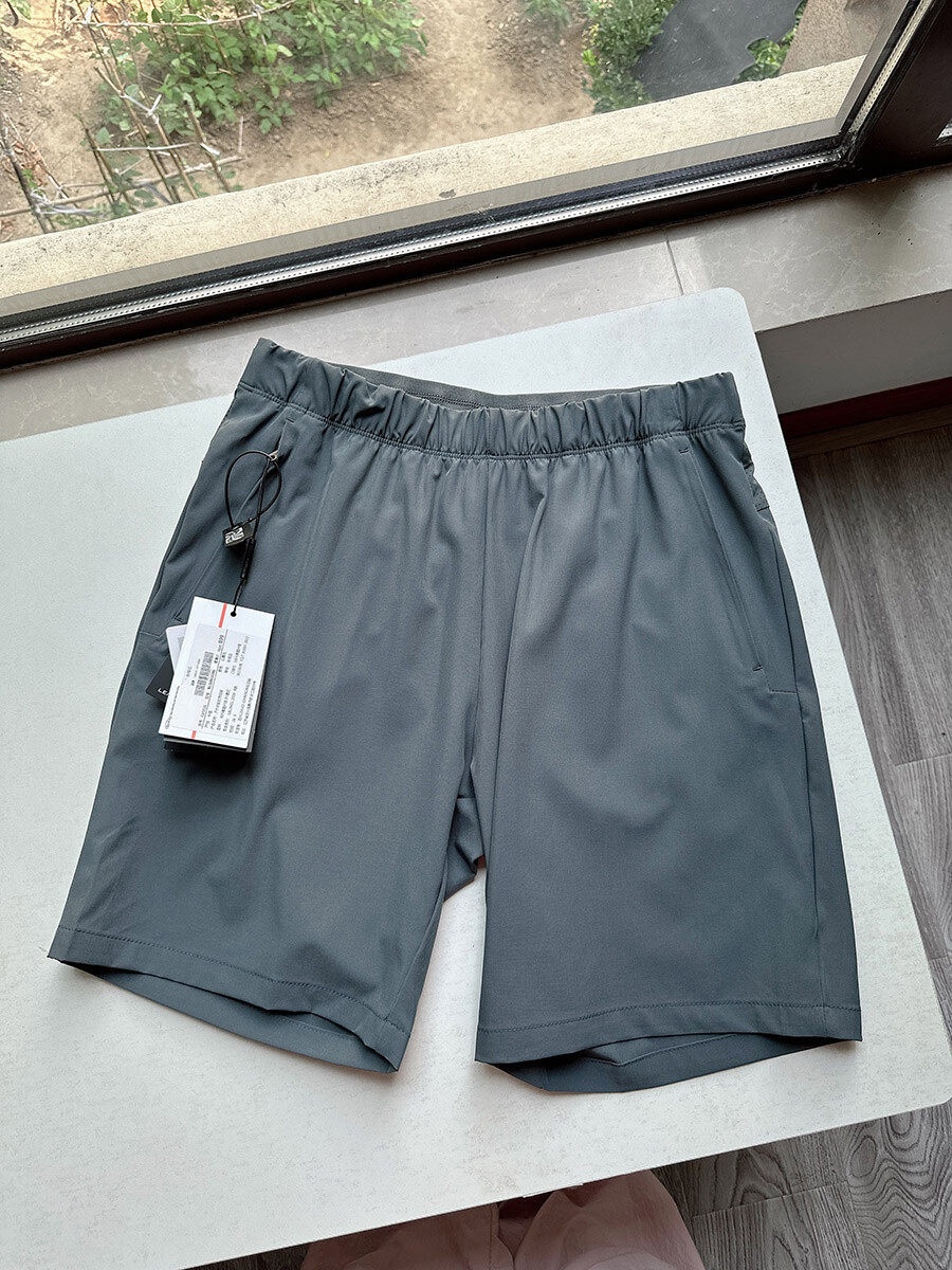 Pantaloncini sportivi da uomo in tessuto Teflon ad asciugatura rapida con tasche con cerniera.