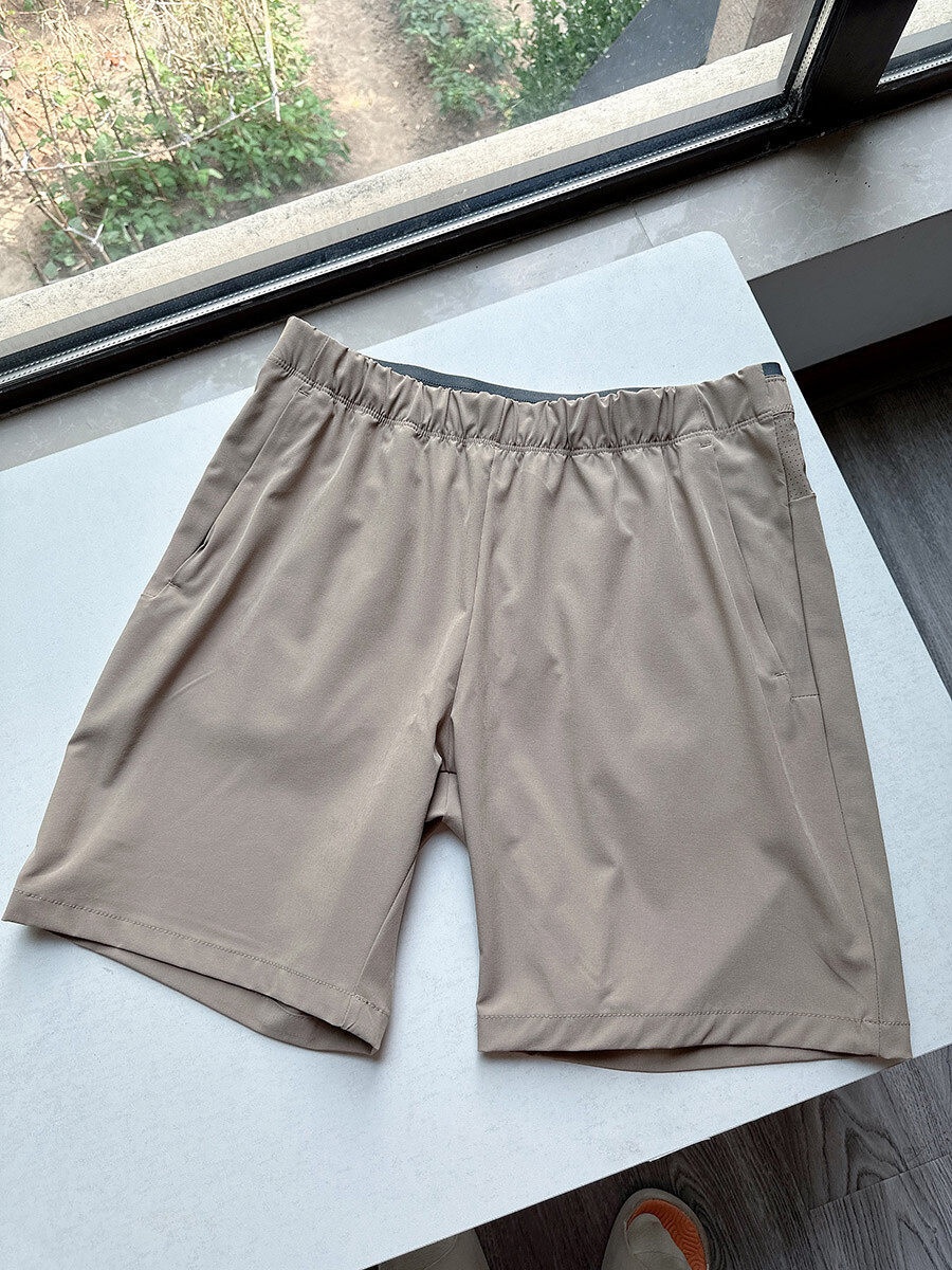 Pantaloncini sportivi da uomo in tessuto Teflon ad asciugatura rapida con tasche con cerniera.