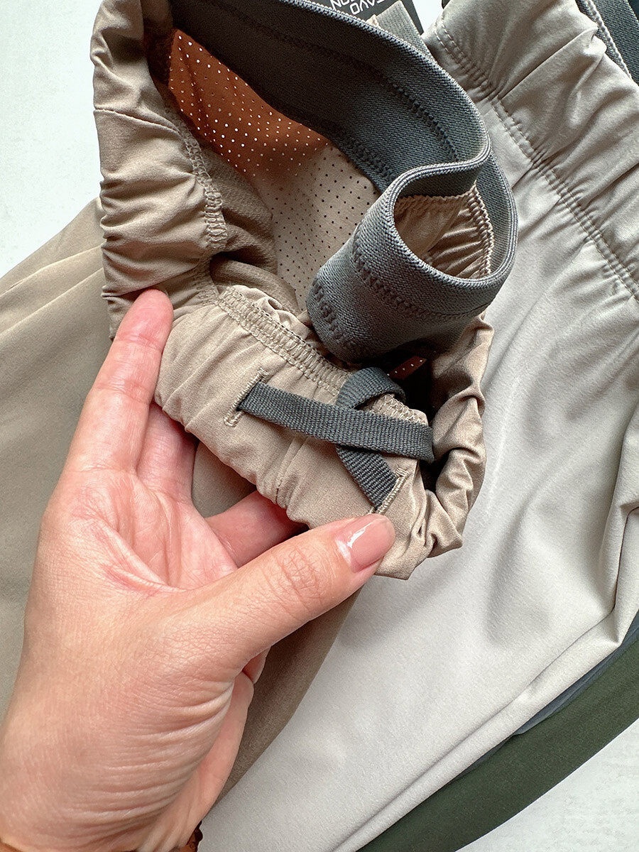 Pantaloncini sportivi da uomo in tessuto Teflon ad asciugatura rapida con tasche con cerniera.