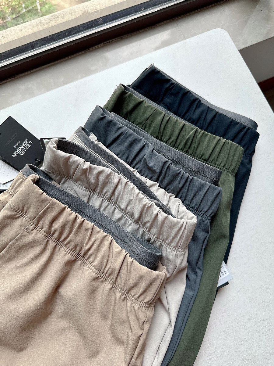 Pantaloncini sportivi da uomo in tessuto Teflon ad asciugatura rapida con tasche con cerniera.
