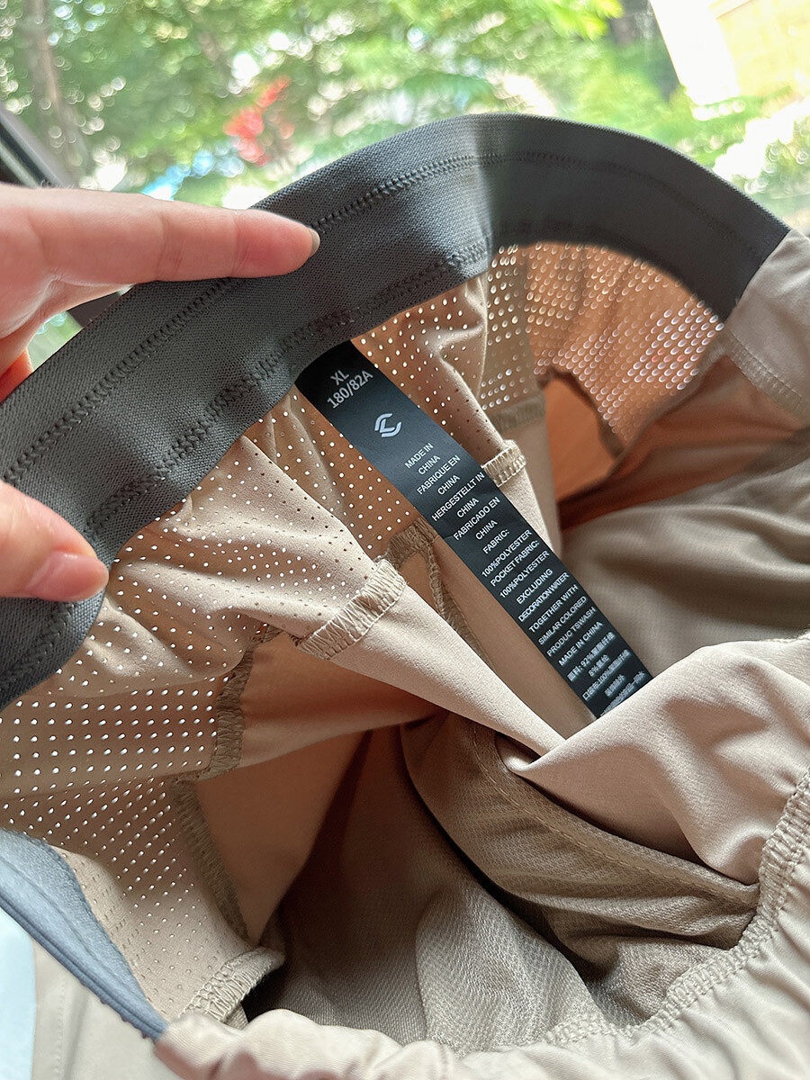 Pantaloncini sportivi da uomo in tessuto Teflon ad asciugatura rapida con tasche con cerniera.