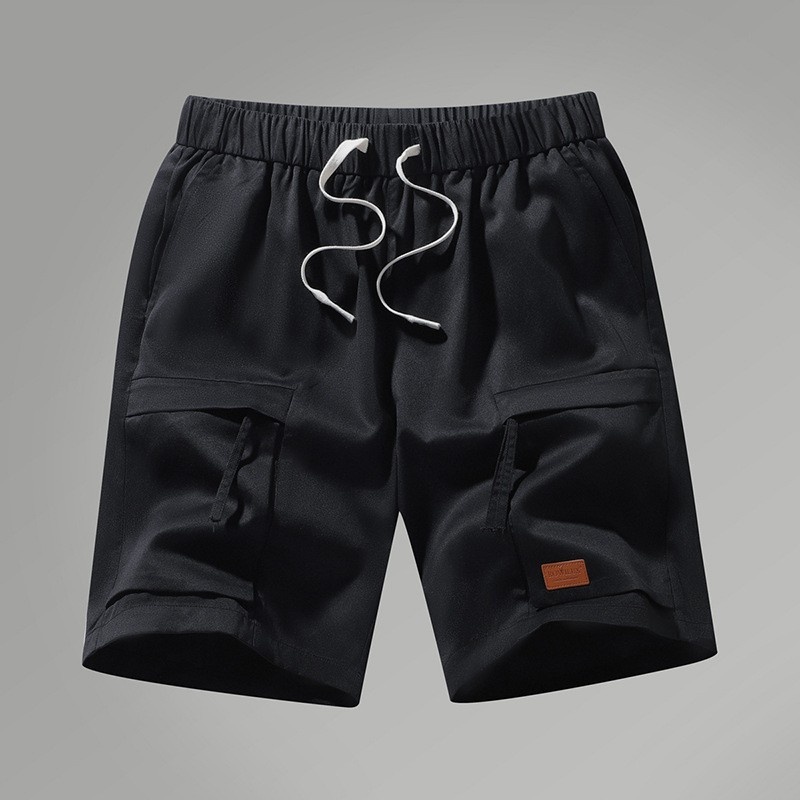 Pantalones cortos cargo informales para hombre con cordón ajustable y bolsillos.