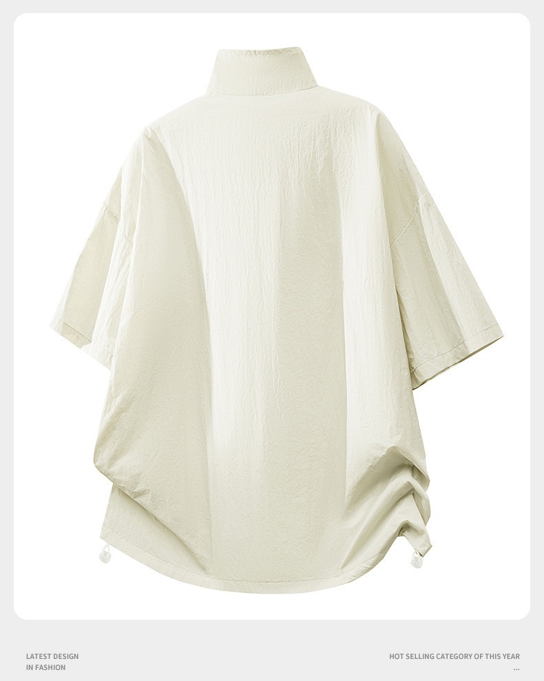 Poncho deportivo unisex ligero con media cremallera.
