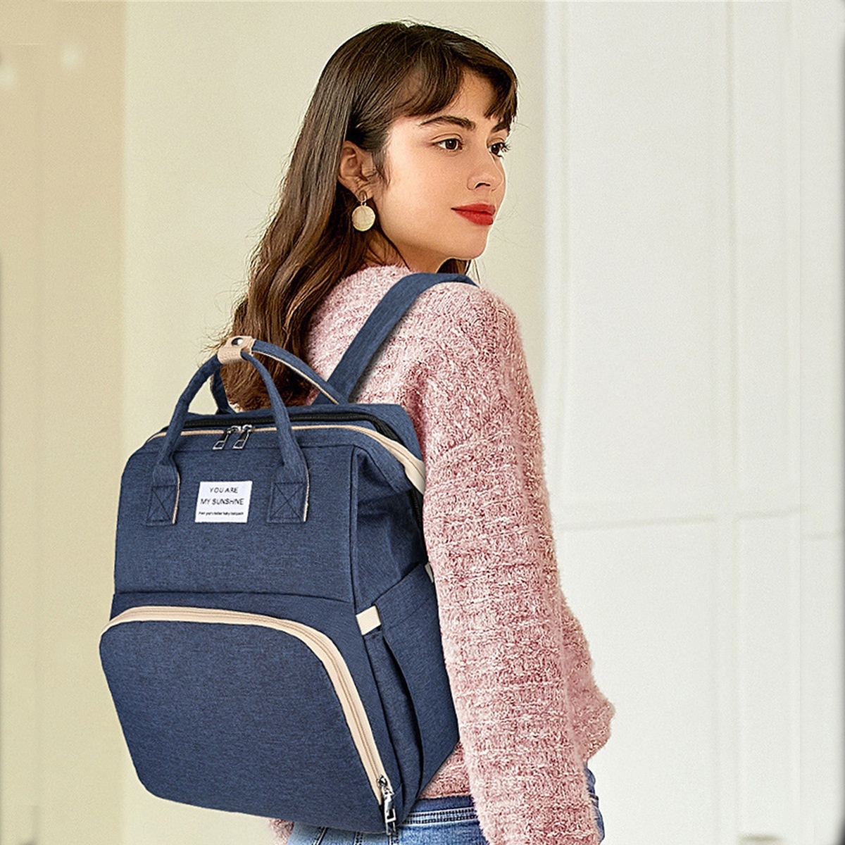Mochila cambiador 2 en 1 con moisés portátil, cambiador, bolsillos térmicos y puerto de carga USB.