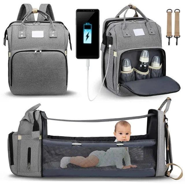 Mochila cambiador 2 en 1 con moisés portátil, cambiador, bolsillos térmicos y puerto de carga USB.