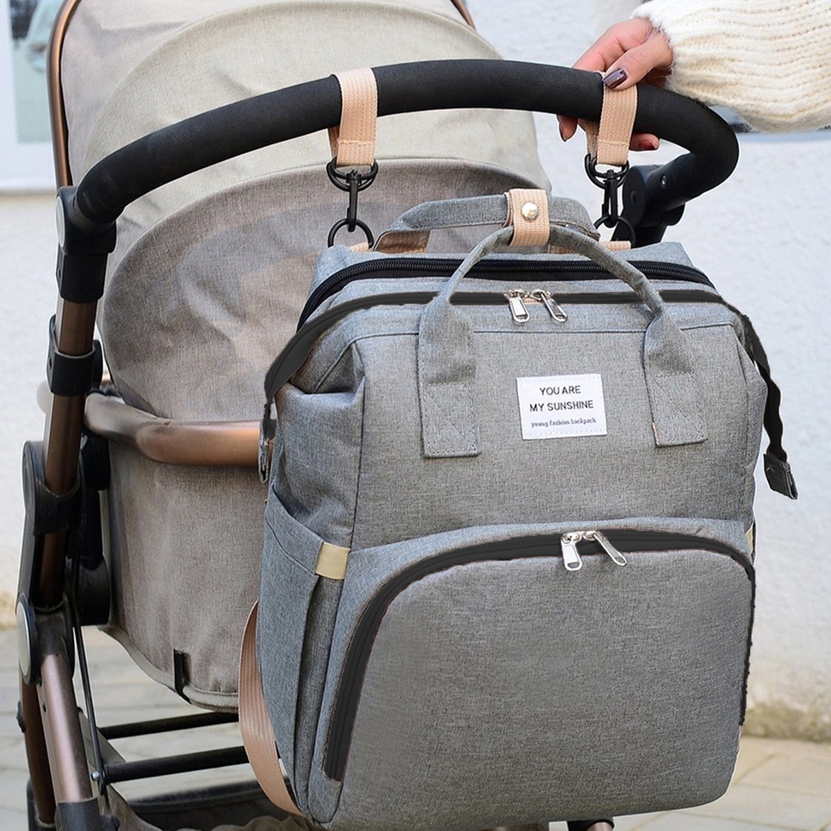 Mochila cambiador 2 en 1 con moisés portátil, cambiador, bolsillos térmicos y puerto de carga USB.