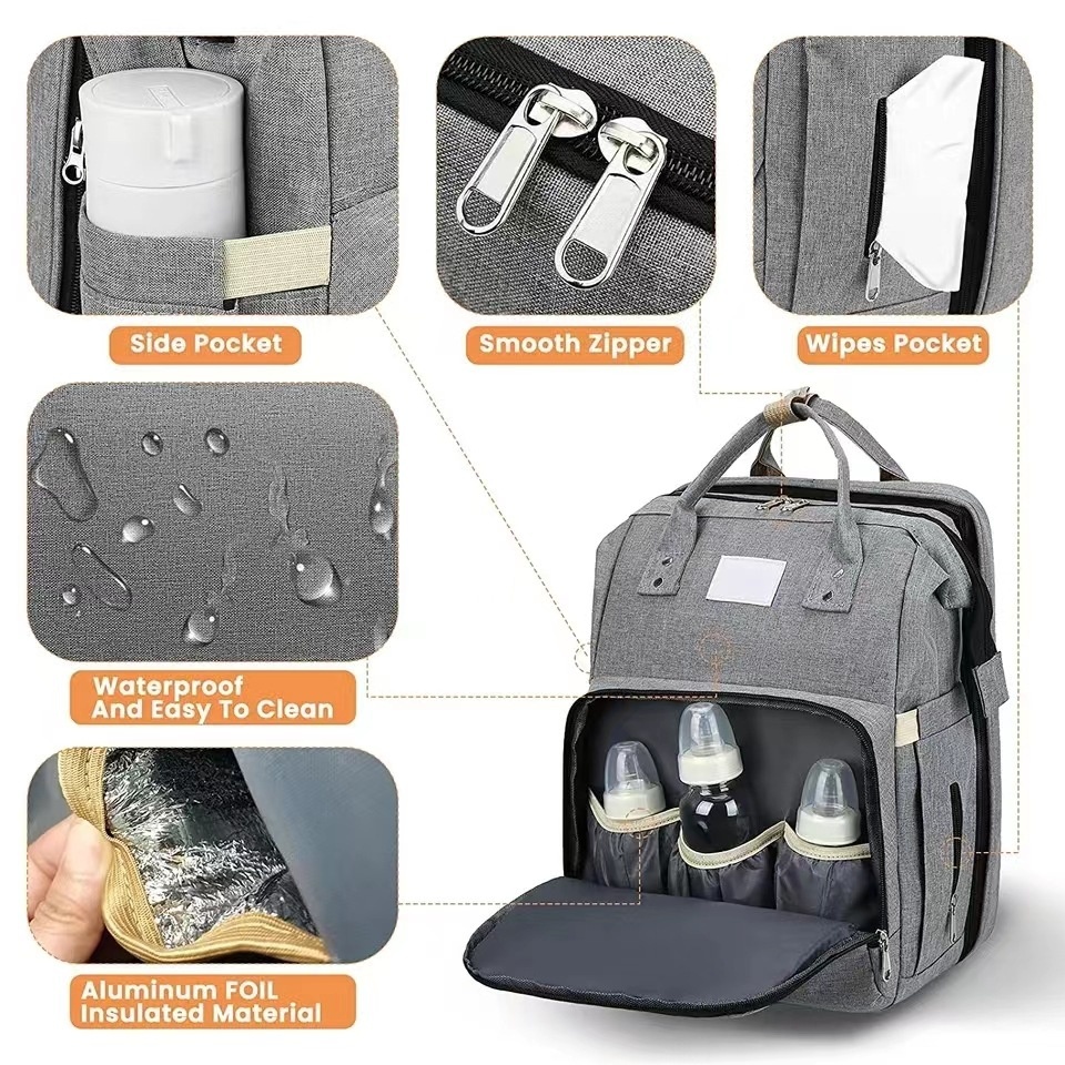 Mochila cambiador 2 en 1 con moisés portátil, cambiador, bolsillos térmicos y puerto de carga USB.