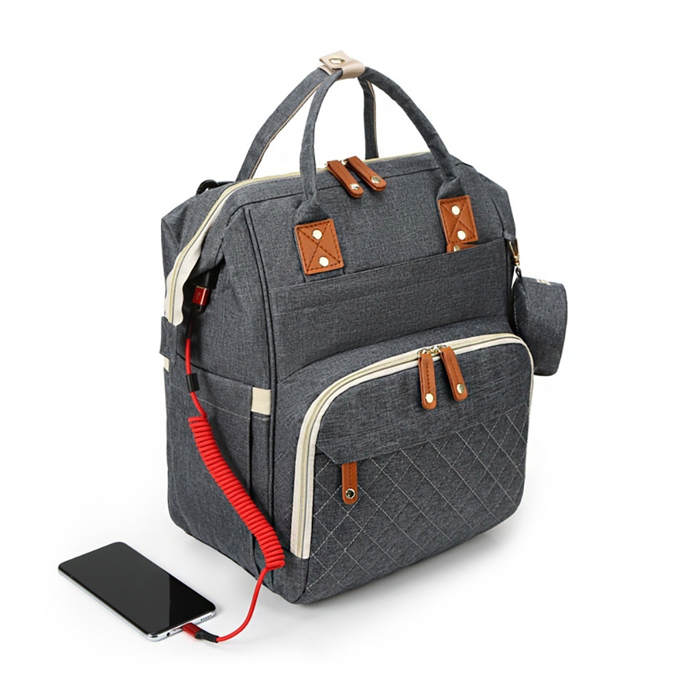 Mochila cambiador multifuncional, bolsa de pañales de viaje para bebé con puerto de carga USB, bolsillos térmicos y correas para cochecito.