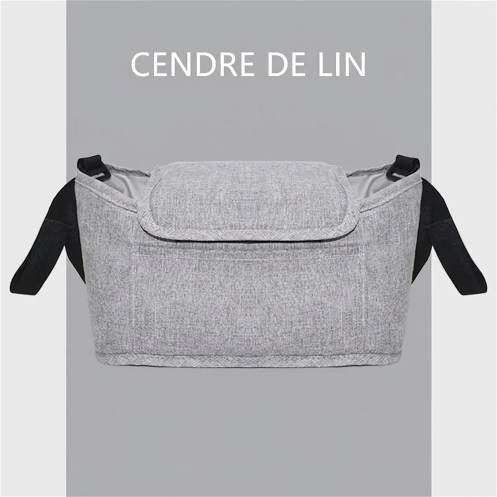 Sac organisateur universel pour poussette avec bandoulière, panier à langer multi-poches avec porte-biberons isothermes et poche imperméable pour mouchoirs.