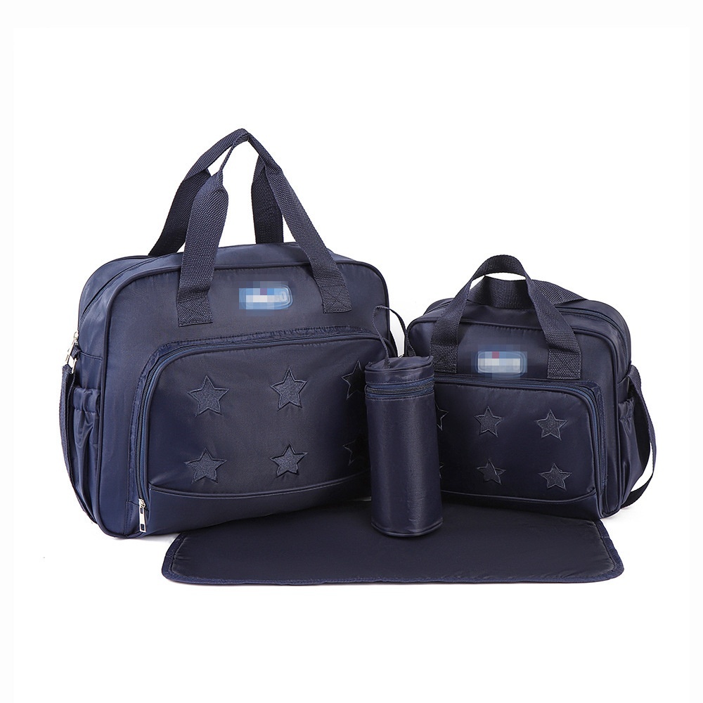 Set multi-pezzo con motivo a stelle per borsa fasciatoio, borsa da viaggio impermeabile con custodia termica per biberon, fasciatoio e pochette per accessori.